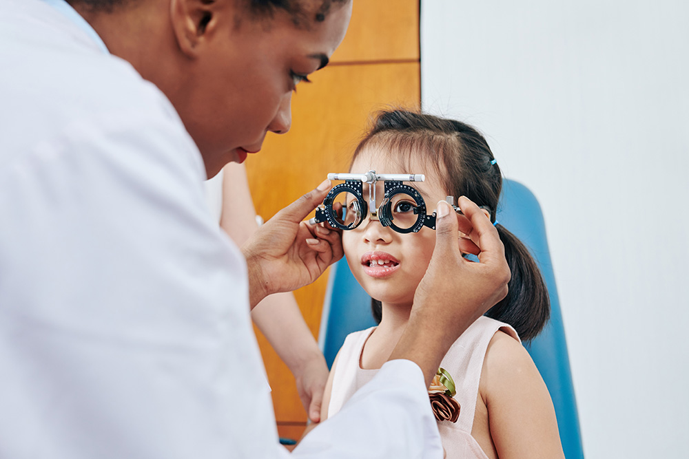 young girls receiving an eye exam from a BRMH ophthalmology provider